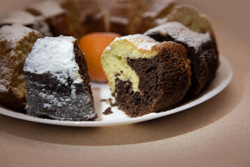 Fresh homemade baking, yellow and dark chocolate cupcake, baking texture, focus on the chocolate part of the cupcake. Homemade pastries made with love