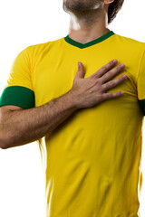 Brazilian soccer player, listening to the national anthem with his hand on his chest