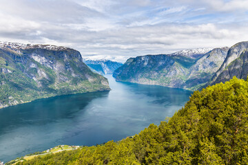 Naklejka na ściany i meble Beautiful panorama of the Aurlandsfjord in Norway as seen from the Stegastein view point