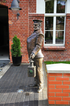 Klaipeda, Lithuania - August 12, 2011: Bronze Sculpture of Railwayman Switchman in Uniform with Lantern on Klaipeda Street.