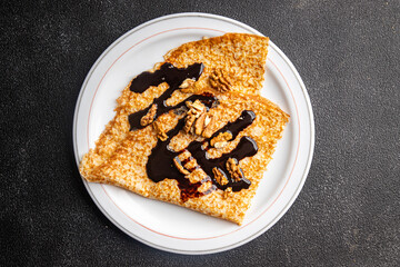 crepe suzette thin pancakes chocolate cheese fresh delicious snack healthy meal food snack on the table copy space food background rustic top view