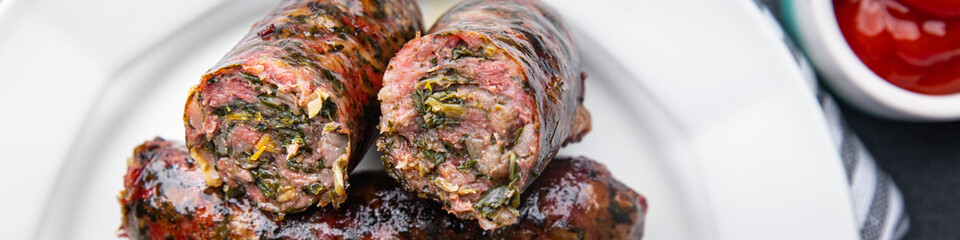 sausage fresh ground meat greens herbs pork, beef, chicken delicious snack healthy meal food snack on the table copy space food background rustic top view