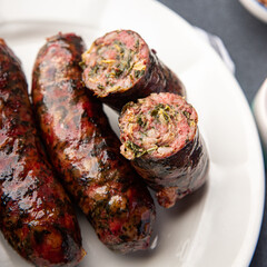 sausage fresh ground meat greens herbs pork, beef, chicken delicious snack healthy meal food snack on the table copy space food background rustic top view