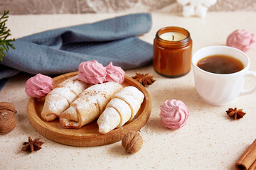 Aesthetics Christmas food background - crescent bagels and marshmallow, walnuts, star anise, coffee. Cozy home.