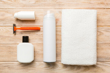 shaving man set. shaving machine, towel, lotion and shaving foam on colored background. Men bath Accessories top view