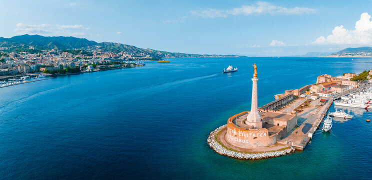 Messina, Sicily, Italy, August 20, 2022. View of the Messina's port with the gold Madonna della Lettera statue