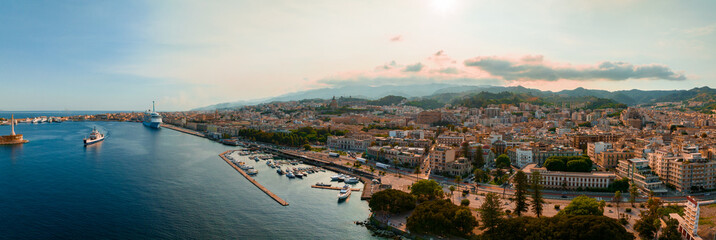 Fototapeta na wymiar Messina, Sicily, Italy, August 20, 2022. View of the Messina's port with the gold Madonna della Lettera statue