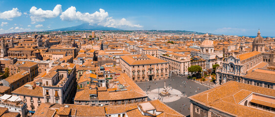 Aerial panoramic view of Catania city in Sicily, Italy. Beautiful holiday town in Italy with Etna...