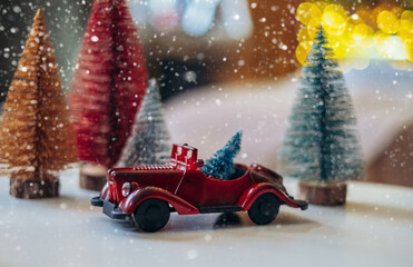 Christmas background with decoration in the form of spruce, festive car