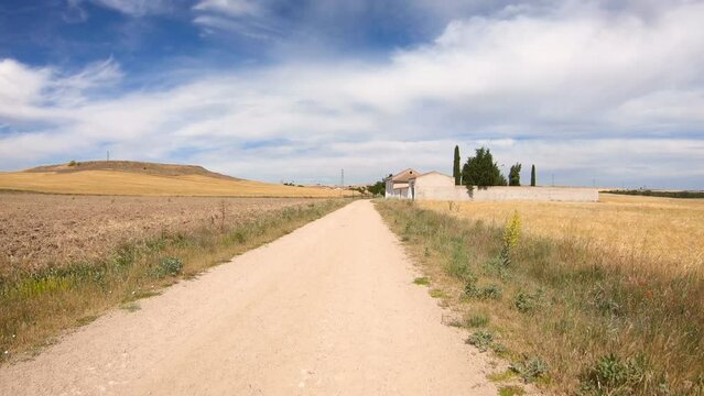Camino de Madrid - a dirt road on a summer landscape next to A&ntilde;e, province of Segovia, Castile and Le&oacute;n, Spain