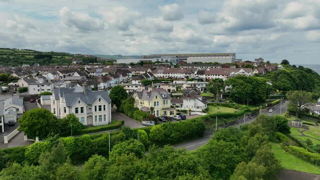 Aerial photo of Residential homes and business Streets and trees in Larne Town County Antrim Northern Ireland