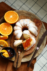Soft and tender orange cake in powdered sugar.