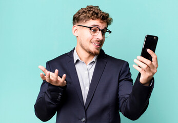 young adult caucasian businessman with a smartphone