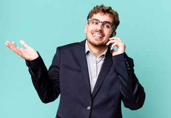 young adult caucasian businessman with a smartphone