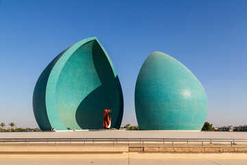 Baghdad, Iraq - November 2022: Split turquoise domes of Al Shaheed war memorial also called as...