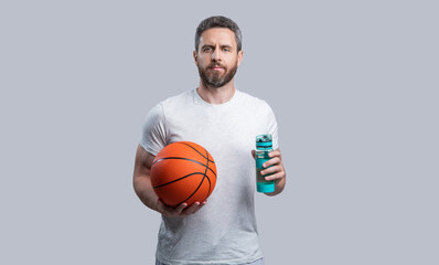 sport man basketball player drinking water. photo of sport man basketball player with ball.