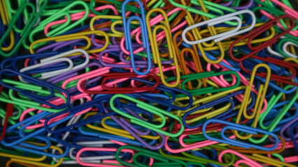 Paper clip isolated on a black background