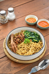 Mie ayam, mi ayam, or bakmi ayam (Indonesian for chicken bakmi, literally chicken noodles). Main ingredients
Noodle, chicken meat, soy sauce, garlic, cooking oil, chicken broth, scallion.