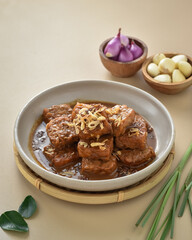 Semur Tempe or Tempeh stew, family favorite dish. Has a sweet and savory taste. Tempeh cooked with soy sauce, then served with a sprinkle of fried onions.
