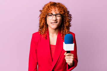 red hair pretty woman looking puzzled and confused. journalist and presenter concept