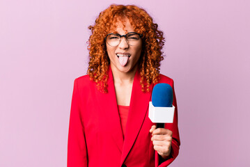 red hair pretty woman feeling disgusted and irritated and tongue out. journalist and presenter...