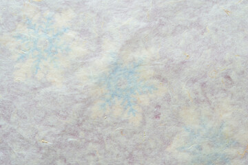 tissue paper background with very faint snowflakes