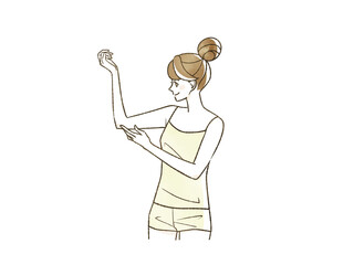 二の腕を触っている笑顔の女性