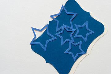 set of blue paper stars on card backdrop