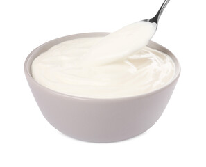 Ceramic bowl and spoon with delicious organic yogurt on white background