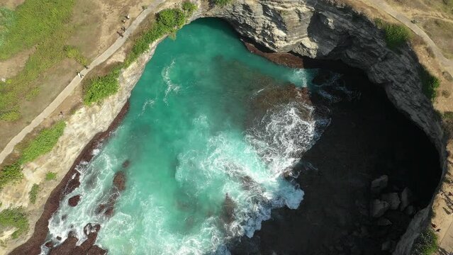 Aerial view of broken beach with natural arch, Nusa Penida, Bali, Indonesia