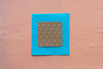 paper square with rounded corners on blue and orange pink background