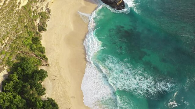 Aerial view of sandy beach and famous rock, Nusa Penida, Bali, Indonesia