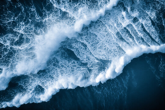 Spectacular aerial top view background photo of ocean sea water white wave splashing in the deep sea. Drone photo backdrop of sea wave in bird eye waves.