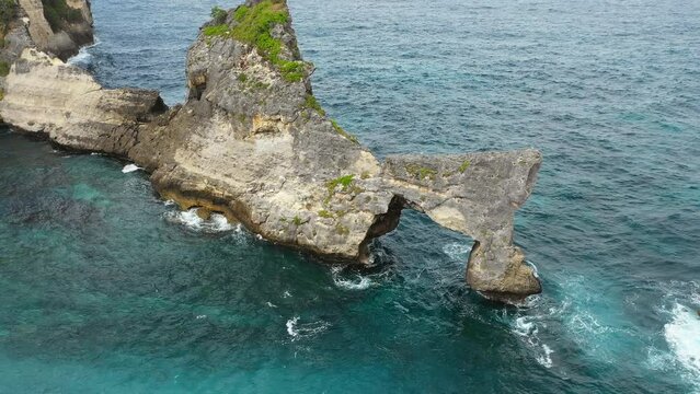 Aerial view of rock formation with natural arch, Nusa Penida, Bali, Indonesia