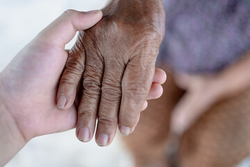 Fototapeta premium boy holding hands with grandma