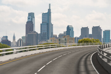 Fototapeta na wymiar Empty urban asphalt road exterior with city buildings background. New modern highway concrete construction. Concept way to success. Transportation logistic industry fast delivery. Philadelphia. USA.