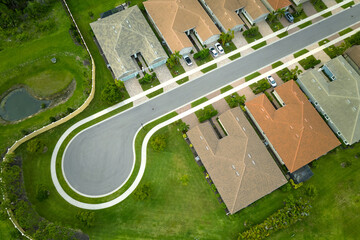 Aerial view of cul de sac at neighbourhood road dead end with densely built homes in Florida closed...