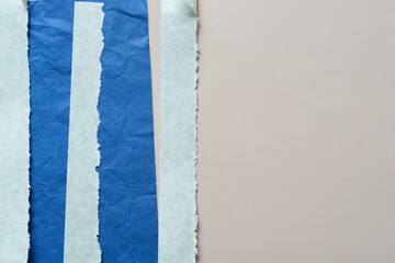 blue paper stripes on beige paper