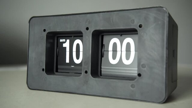 Flip clock shows it's 10 a.m. time