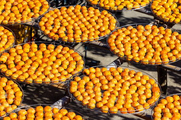 Dry Persimmon fruit production under sunshine in factory