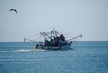 The shrimp boat moving on the ocean near Mazatlan, Mexico