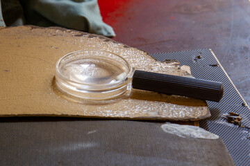 Crime scene with blood stains and a magnifying glass image for background use