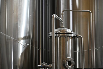 Modern beer cellar with stainless steel leg support tanks