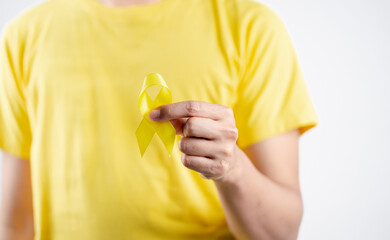 man showing yellow ribbon, september, suicide prevention day, childhood, sarcoma, bone and bladder...