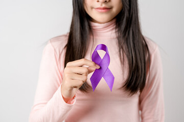 woman hands holding purple ribbon, Alzheimer disease, Pancreatic cancer, Epilepsy awareness, world...