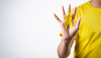 man showing yellow ribbon, september, suicide prevention day, childhood, sarcoma, bone and bladder...