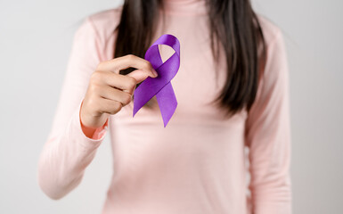 woman hands holding purple ribbon, Alzheimer disease, Pancreatic cancer, Epilepsy awareness, world...