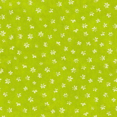 Bright green colored floral seamless pattern. Gouache painting small flowers on textured light green background. Vintage Template for design, textile, wallpaper, bedding, ceramics.