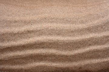 Fototapeta na wymiar sand waves, beige texture background