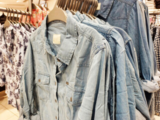 Indian men's latest fashion dress hung on hangers, in a retail store in the market, traditional wear for men.